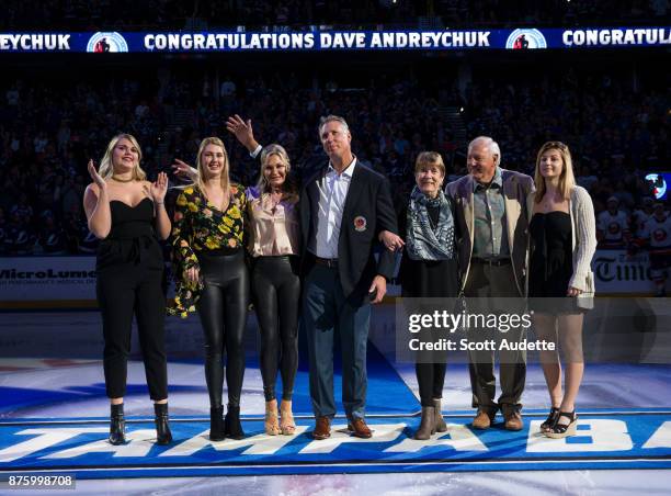 Dave Andreychuk is honored by the Tampa Bay Lightning after being inducted into the Hockey Hall of Fame before the game against the New York...