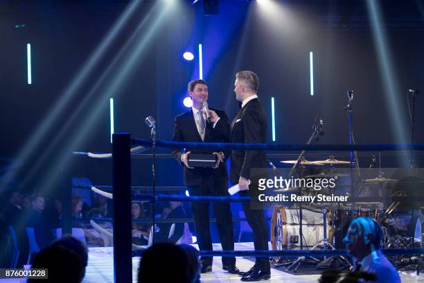 Managing Director IWC Switzerland Linus Fuchs and Rainer Maria Salzgeber present the watch to be auctioned during the 11th Laureus Charity Night at...