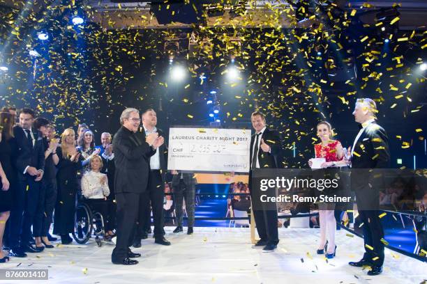 Christian Stucki, winner of this year's 'Unspunnen Schwinget' presents the Laureus Foundation Switzerland with a cheque of almost CHF 3 000 000...
