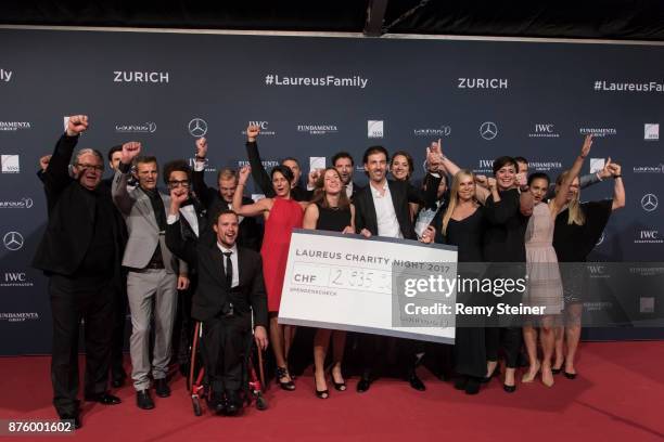 The Laureus Family presents the cheque of almost CHF 3 000 000 going to the Laureus Foundation Switzerland during the 11th Laureus Charity Night at...