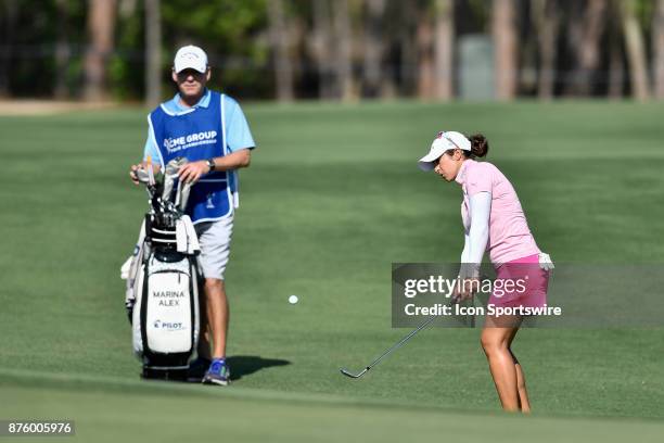 Azahara Munoz of Spain chips onto the green on the seventeenth hole during the third round of the LPGA CME Group Championship at Tiburon Golf Club on...