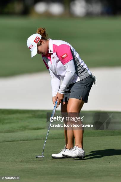 Ariya Jutanugarn of Thailand sinks her putt on the seventeenth hole during the third round of the LPGA CME Group Championship at Tiburon Golf Club on...