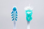 Image of used old and new toothbrushes isolated on a white backg
