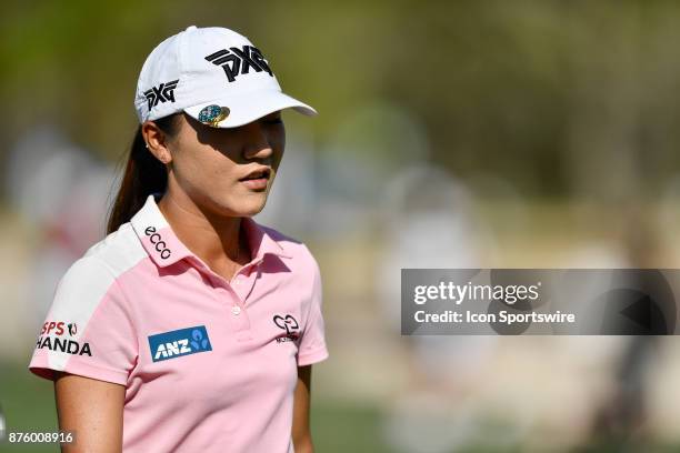 Lydia Ko of New Zealand walks off the seventeenth hole after a successful birdie putt during the third round of the LPGA CME Group Championship at...