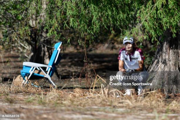 Sung Hyun Park of South Korea looks out from the rough where her ball lies on the seventeenth hole during the third round of the LPGA CME Group...