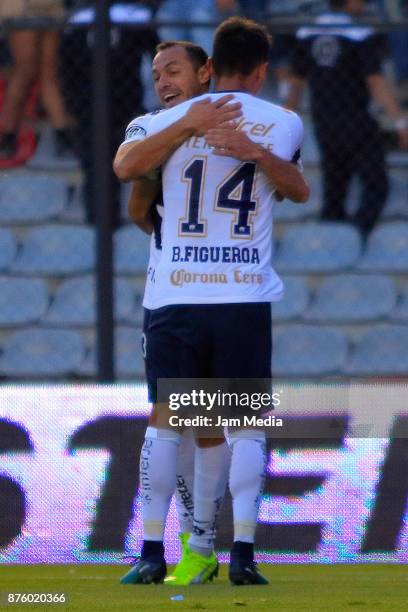Marcelo Diaz and Brian Figueroa of Pumas celebreate their team's tying goal during the 17th round match between Queretaro and Pumas UNAM as part of...