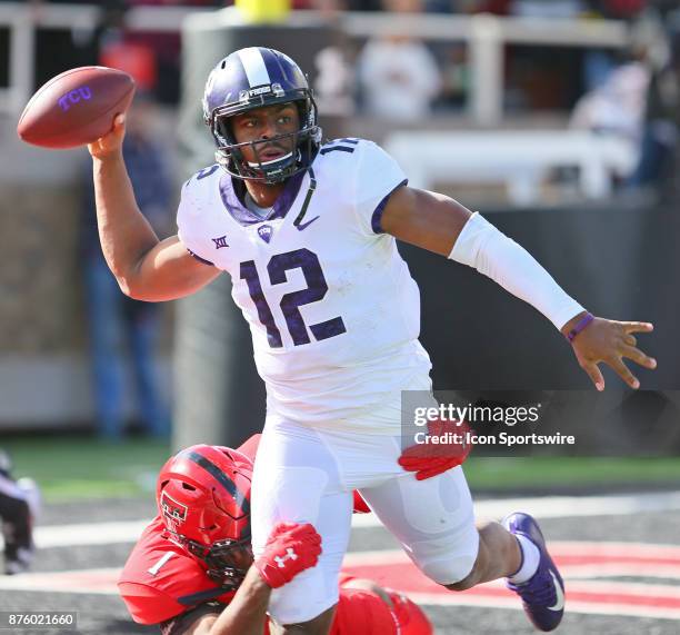 Texas Christian quarterback Shawn Robinson throws as he is brought down by Texas Tech linebacker Jordyn Brooks during the Texas Tech Raider's 27-3...