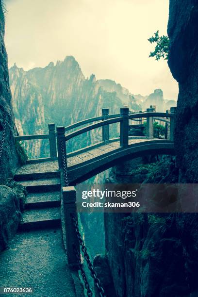 huangshan chinese mountain path landscape in china filtered to look like film vintage style - anhui stock pictures, royalty-free photos & images