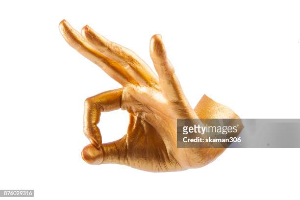 selective focus golden hand pose with white background - metal fingers stock pictures, royalty-free photos & images