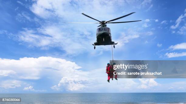 background concept for rescue helicopter in mission sea rescue . - rope high rescue photos et images de collection