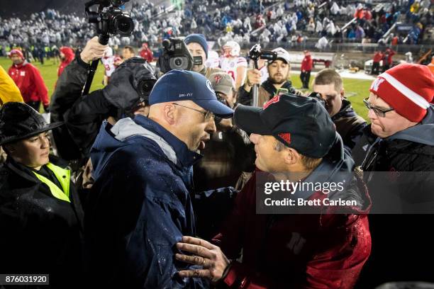 Head coach James Franklin of the Penn State Nittany Lions shakes hands with head coach Mike Riley of the Nebraska Cornhuskers after the game on...