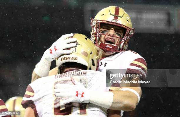 Korab Idrizi of the Boston College Eagles celebrates with Chris Garrison after a touchdown during the second quarter against the Connecticut Huskies...