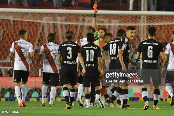 Referee Silvio Trucco shows the red card to German Lux of River Plate during a match between Independiente and River Plate as part of the Superliga...