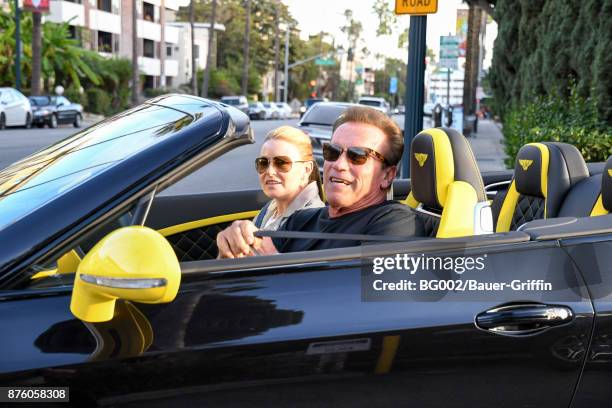 Heather Milligan and Arnold Schwarzenegger are seen on November 18, 2017 in Los Angeles, California.