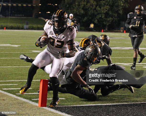 Larry Rountree III of the Missouri Tigers scores a touchdown against LaDarius Wiley of the Vanderbilt Commodores during the first half at Vanderbilt...