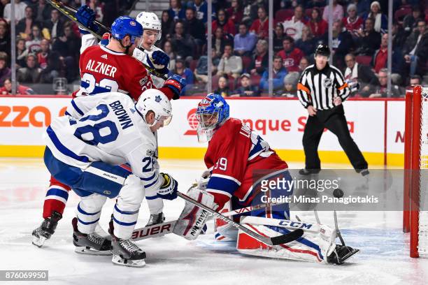 Connor Brown of the Toronto Maple Leafs gets the puck past goaltender Charlie Lindgren of the Montreal Canadiens in the third period during the NHL...