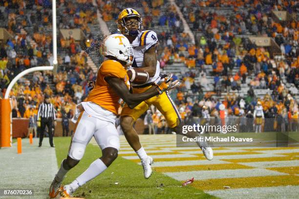 Grant Delpit of the LSU Tigers breaks up a pass intended for Brandon Johnson of the Tennessee Volunteers during the second half at Neyland Stadium on...