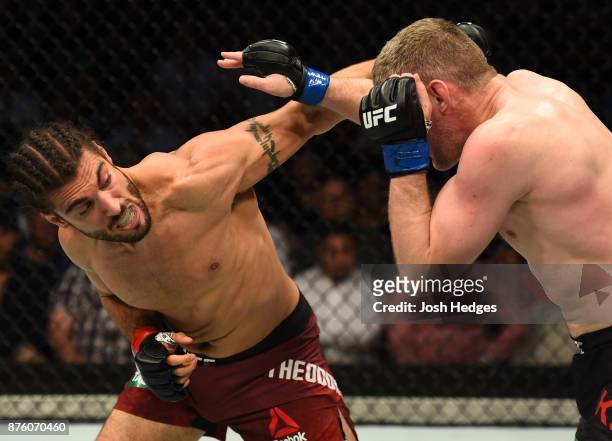 Elias Theodorou of Canada punches Daniel Kelly of Australia in their middleweight bout during the UFC Fight Night event inside the Qudos Bank Arena...