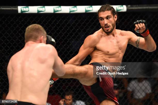 Elias Theodorou of Canada kicks Daniel Kelly of Australia in their middleweight bout during the UFC Fight Night event inside the Qudos Bank Arena on...