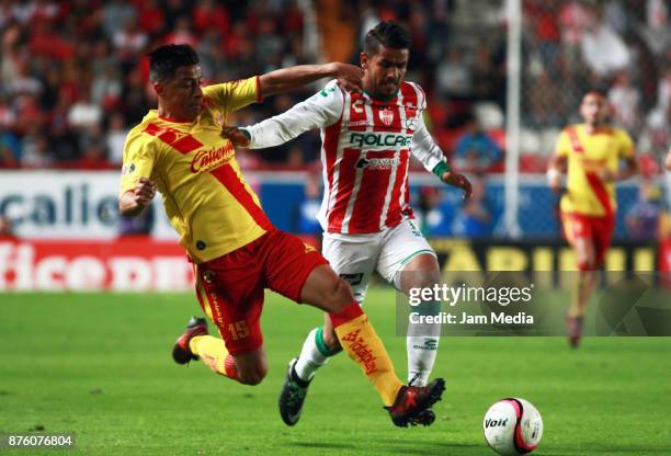 Angel Sepulveda of Morelia and Miguel Ponce of Necaxa fight for the ball during the 17nd round match between Necaxa and Morelia as part of the Torneo...