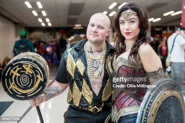 Cosplayers in character as a gender bend Nightclub Suicide Squad Harley Quinn and Wonder Woman during the Birmingham MCM Comic Con held at NEC Arena...
