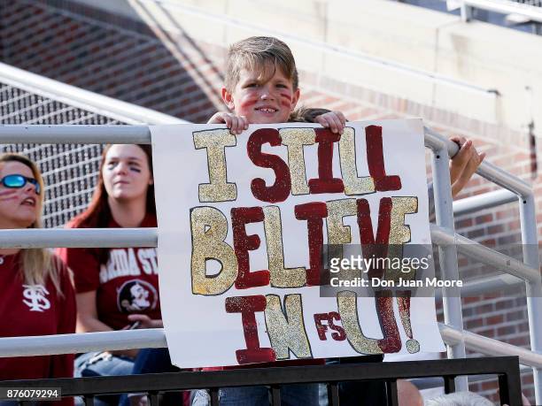 Young fan of the Florida State Seminoles holds up a sign during the game against the Delaware State Hornets at Doak Campbell Stadium on Bobby Bowden...