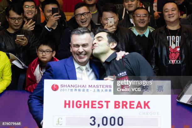 Ronnie O'Sullivan of England receives a cheque from World Professional Billiards and Snooker Association chairman Jason Ferguson after winning the...