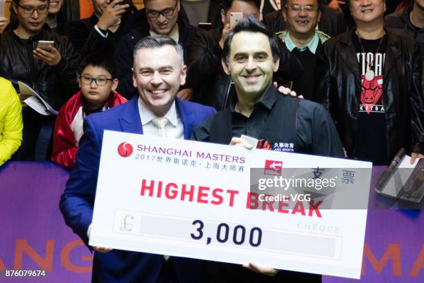 Ronnie O'Sullivan of England receives a cheque from World Professional Billiards and Snooker Association chairman Jason Ferguson after winning the...