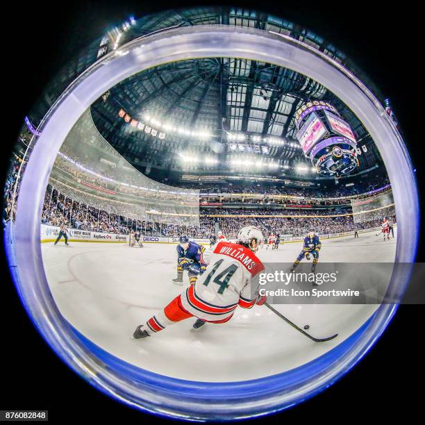 Carolina Hurricanes Right Wing Justin Williams skates with the puck as Sabres players close in during the Carolina Hurricanes and Buffalo Sabres NHL...