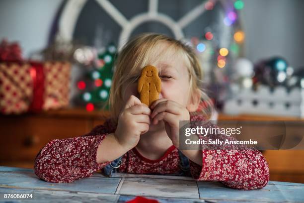 child holding a gingerbread - gingerbread cookie stock pictures, royalty-free photos & images