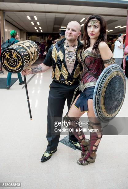 Cosplayers in character as a gender bend Nightclub Suicide Squad Harley Quinn and Wonder Woman during the Birmingham MCM Comic Con held at NEC Arena...