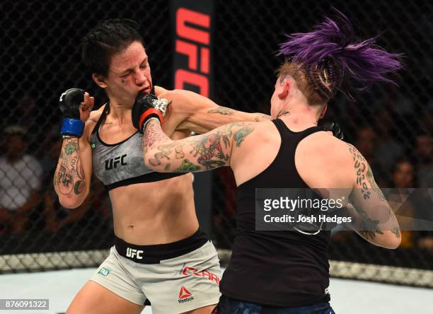 Bec Rawlings of Australia punches Jessica-Rose Clark in their women's flyweight bout during the UFC Fight Night event inside the Qudos Bank Arena on...