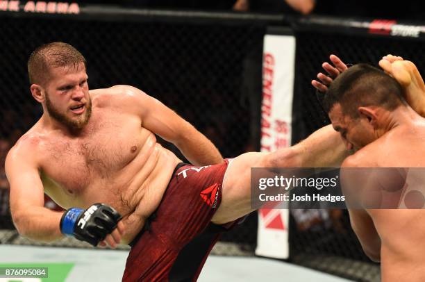 Marcin Tybura of Poland kicks Fabricio Werdum of Brazil in their heavyweight bout during the UFC Fight Night event inside the Qudos Bank Arena on...