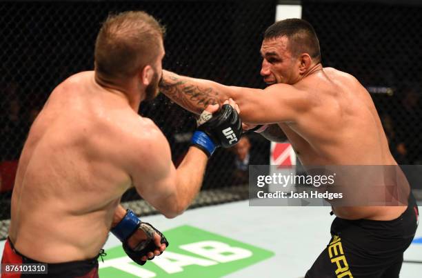 Fabricio Werdum of Brazil punches Marcin Tybura of Poland in their heavyweight bout during the UFC Fight Night event inside the Qudos Bank Arena on...