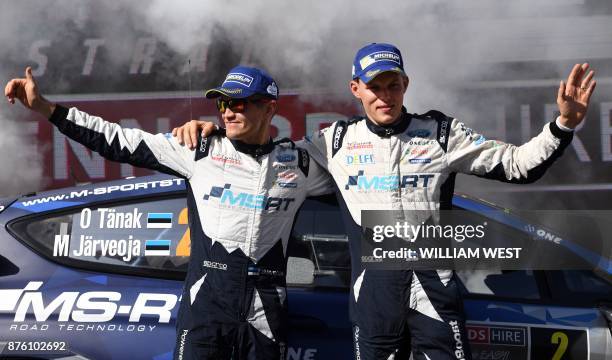 Ford driver Ott Tanak of Estonia and co-driver Martin Järveoja wave to the crowd after finishing second in the World Rally Championship event Rally...