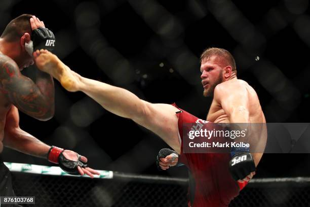 Marcin Tybura of Poland kicks Fabricio Werdum of Brazil in their heavyweight bout during the UFC Fight Night at Qudos Bank Arena on November 19, 2017...