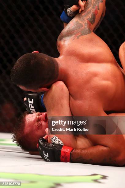 Marcin Tybura of Poland and Fabricio Werdum of Brazil wrestle in their heavyweight bout during the UFC Fight Night at Qudos Bank Arena on November...