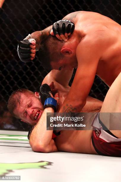 Marcin Tybura of Poland and Fabricio Werdum of Brazil wrestle in their heavyweight bout during the UFC Fight Night at Qudos Bank Arena on November...