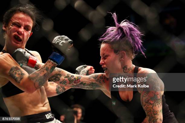 Bec Rawlings of Australia punches Jessica-Rose Clark of Australia in their women's flyweightbout during the UFC Fight Night at Qudos Bank Arena on...