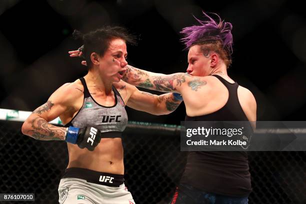 Bec Rawlings of Australia punches Jessica-Rose Clark of Australia in their women's flyweightbout during the UFC Fight Night at Qudos Bank Arena on...