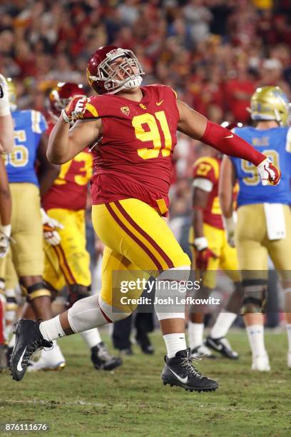 Brandon Pili of the USC Trojans celebrates after the UCLA Bruins miss a field goal during the NCAA college football game at the Los Angeles Memorial...