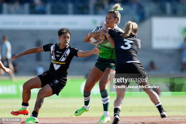 Kiana Takairangi of the Cook Islands is tackled during the 2017 Women's Rugby League World Cup match between New Zealand and Cook Islands at Southern...