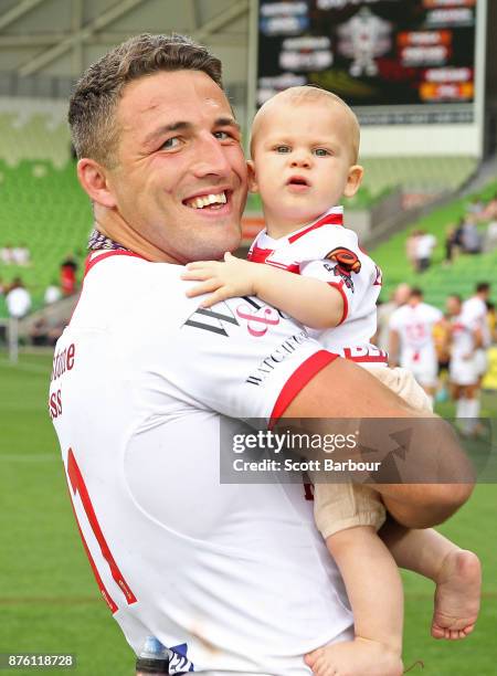 Sam Burgess of England celebrates with his baby daughter Poppy Alice Burgess after winning the 2017 Rugby League World Cup Quarter Final match...