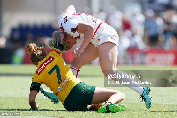 Charlotte Booth of England is tackled by Caitlin Moran of Australia during the 2017 Women's Rugby League World Cup match between Australia and...