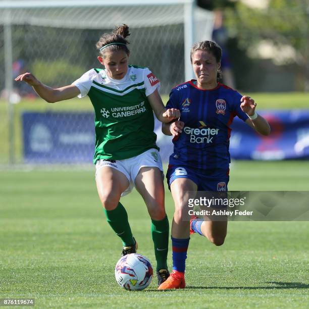 Ashleigh Sykes of Canberra United contests the ball against Sophie Nenadovic of the Jets during the round four W-League match between Newcastle and...