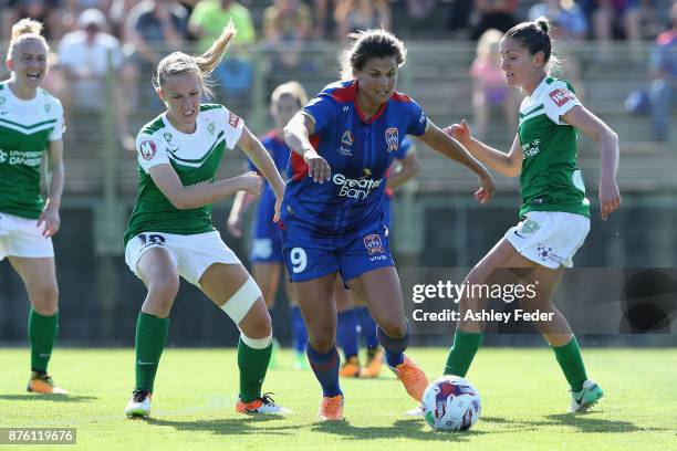 Katherine Stengel of the Jets contests the ball against Taren King of Canberra United during the round four W-League match between Newcastle and...