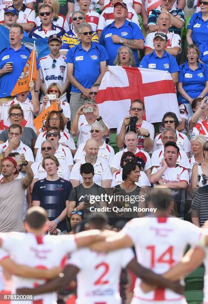 Fans watch on as the English team stand for their national anthem during the 2017 Rugby League World Cup Quarter Final match between England and...