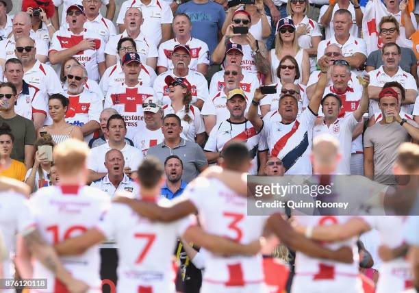 Fans watch on as the English team stand for their national anthem during the 2017 Rugby League World Cup Quarter Final match between England and...