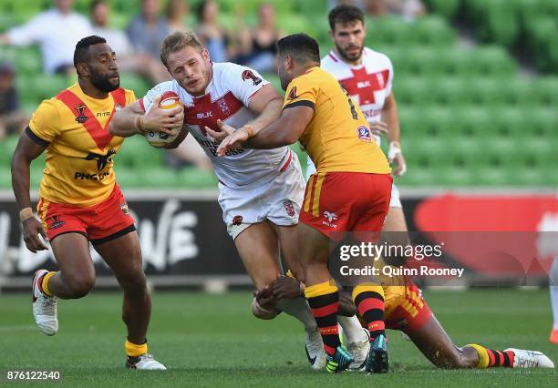 Thomas Burgess of England is tackled during the 2017 Rugby League World Cup Quarter Final match between England and Papua New Guinea Kumuls at AAMI...