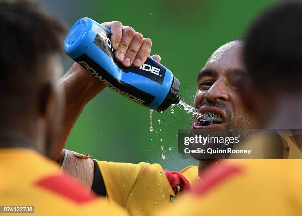 Papua New Guinea players take a drink during the 2017 Rugby League World Cup Quarter Final match between England and Papua New Guinea Kumuls at AAMI...